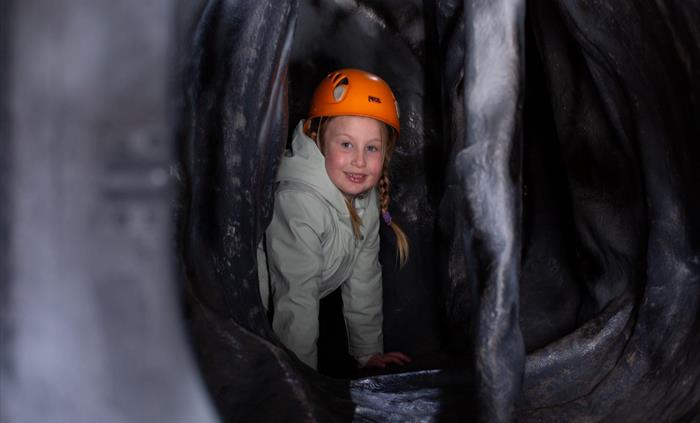 The artificial cave at Parc Bryn Bach is full of twists and turns.